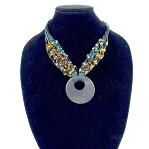Erica Lyons 1980's Tribal Beaded Cord Necklace With Wood Pendant Black/Multi